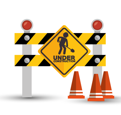 Under construction sign with cones and barrier
